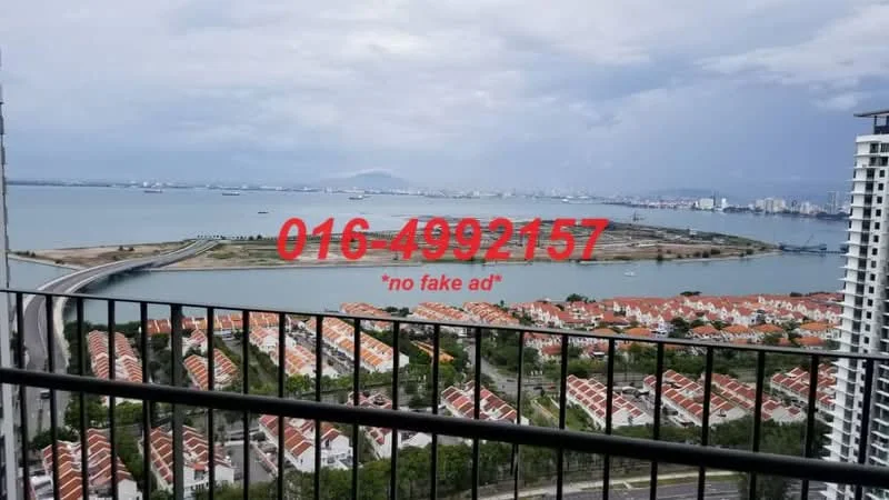 Exterior type: high-rise condominium; features: balcony with railing, panoramic sea view, view of residential area, surrounding greenery, urban skyline in background, cloudy sky; style: modern.