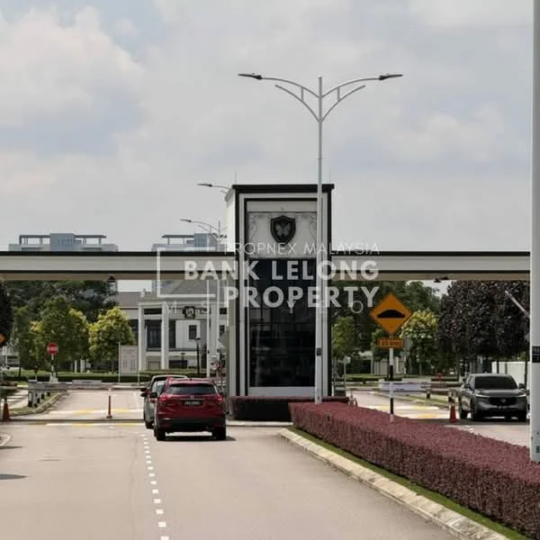 Exterior type: main entrance gate; features: guard house at entrance, paved driveway, landscaped hedges, street lamps, signage for property, surrounded by greenery, traffic signage, two-lane road; style: modern.