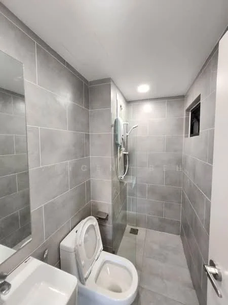 Bathroom features: grey tiled walls, grey tiled flooring, walk-in shower with glass enclosure, rain shower head, handheld shower, single-sink vanity with white cabinet, framed mirror, one-piece toilet, recessed downlights, window for natural light; style: modern.
