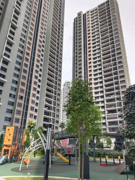 Exterior type: high-rise condominium; features: two high-rise buildings, playground area with climbing structures, green landscaping with trees, manicured lawn, outdoor play equipment, surrounding residential area, modern architectural design, glass windows, balconies on upper floors; style: modern.