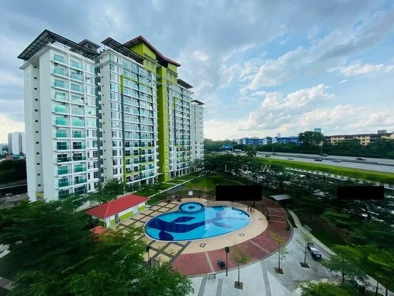 Exterior type: high-rise condominium; features: glass curtain wall, green accent facade, recessed balconies, swimming pool with artistic design, landscaped garden area, manicured lawn, paved walkways, surrounded by mature trees, adjacent to highway; style: modern.