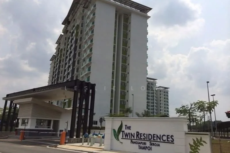 Exterior type: high-rise condominium; features: white painted facade, glass curtain wall, recessed balconies, landscaped entrance, manicured lawn, surrounded by greenery, multi-storey building, signage at entrance; style: modern.