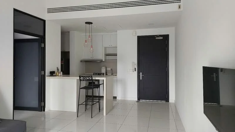 Kitchen features: white cabinetry, marble countertop, stainless-steel sink, chrome pull-down faucet, built-in oven, freestanding range oven, refrigerator, pendant lighting, bar stools, open layout, white tiled flooring, wall-mounted TV, black accent wall; style: modern. Living features: black sofa, wall-mounted TV, white tiled flooring; style: modern.