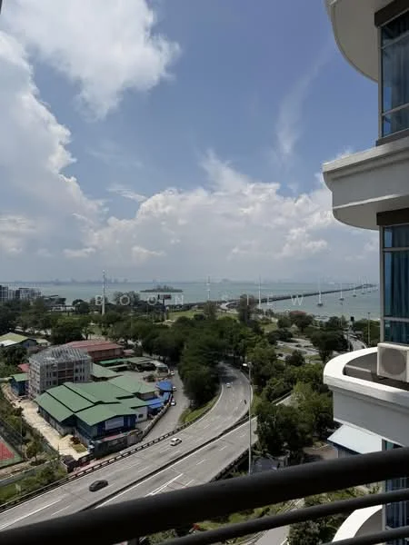 Exterior type: high-rise condominium; features: sea view, city skyline in background, surrounded by greenery, near main road, balcony visible, multiple storeys, near waterfront; style: modern.