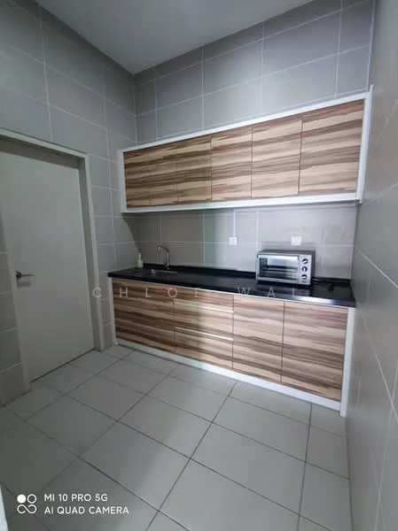 Kitchen features: laminate cabinetry with wood finish, black countertop, stainless-steel sink, chrome faucet, built-in microwave, white tiled walls, grey tiled flooring, single door, under-cabinet lighting; style: modern.