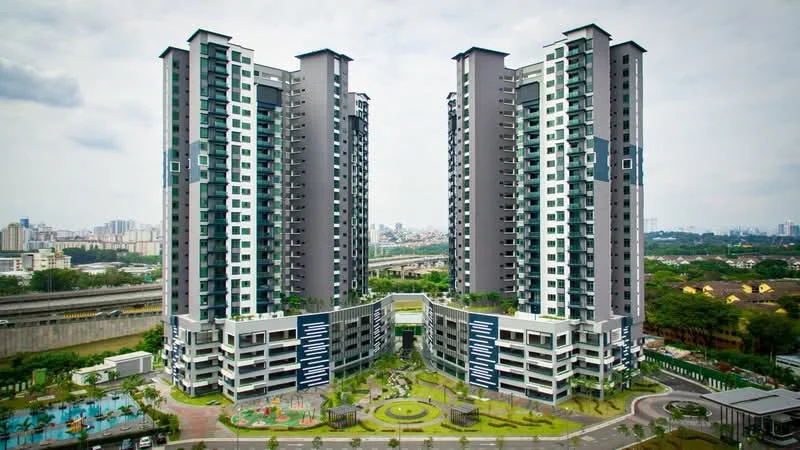 Exterior type: high-rise condominium; features: glass curtain wall, grey painted facade, recessed balconies, landscaped garden, children's playground, swimming pool deck, multi-storey car park, surrounded by mature greenery, urban skyline in background; style: modern.