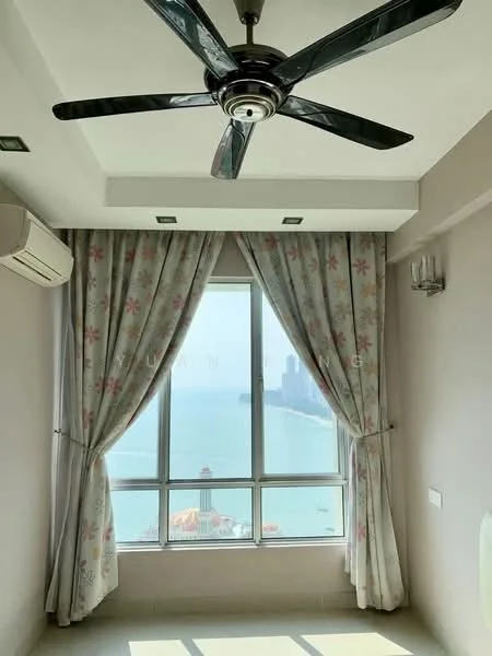 Room features: floor-to-ceiling windows, sheer curtains with floral pattern, 5-blade ceiling fan with light, wall-mounted split AC, light grey painted walls, neutral tile flooring, city view, natural light; style: modern; view: sea.