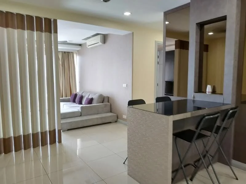 Living features: grey fabric sofa, 4-seater dining table with black chairs, tile flooring, cream painted walls, recessed downlights, floor-to-ceiling windows with sheer curtains, air conditioning unit, decorative wall paneling; style: modern.