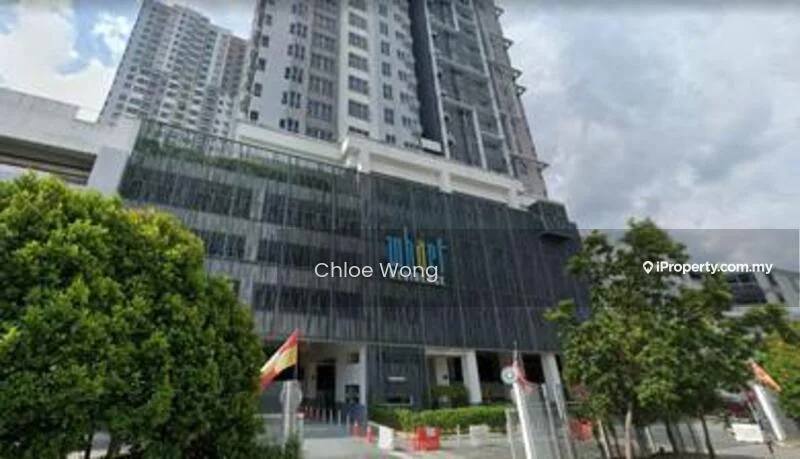 Exterior type: high-rise condominium; features: glass curtain wall, exposed concrete facade, recessed balconies, feature lighting at night, manicured lawn, mature trees, surrounded by greenery, gated entry, guard house at entrance; style: modern.