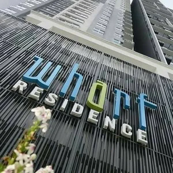 Exterior type: high-rise condominium; features: glass curtain wall, vertical fins, feature signage, modern facade, approximately 20-storey high-rise; style: modern.
