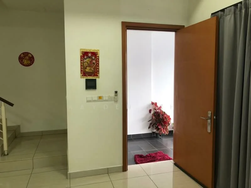 Room features: white painted walls, cream tiled flooring, wooden door, grey curtains, decorative wall art, small potted plant, red area rug, light switch, doorbell, staircase visible; style: modern.
