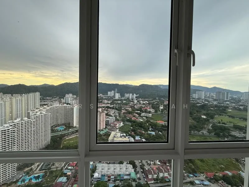 Exterior type: high-rise condominium; features: city skyline view, mountain view, glass windows, multiple high-rise buildings in view, green landscape in foreground, cloudy sky; style: modern.