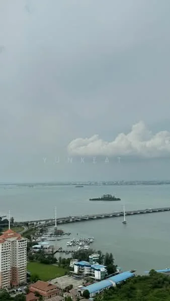 Exterior type: high-rise condominium; features: waterfront view, city skyline in background, marina with boats, bridge visible, green landscaping, surrounding water body; style: modern.
