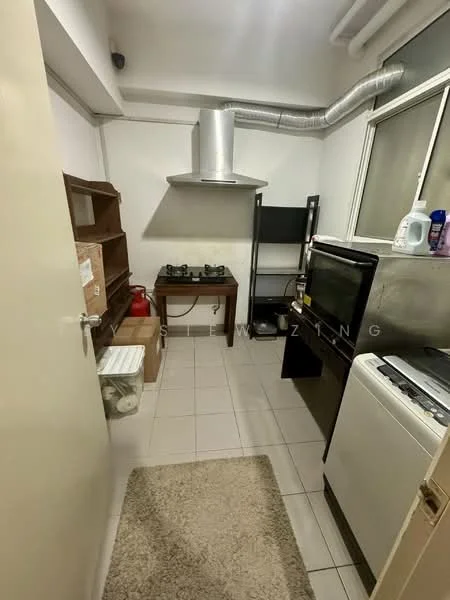 Kitchen features: white painted walls, tile flooring, stainless-steel range hood, 2-burner gas hob, black freestanding oven, white dishwasher, wooden kitchen table, black shelving unit, window with sheer curtains, refrigerator, area rug.