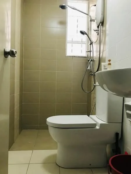 Bathroom features: white toilet, single-sink vanity with wall-mounted faucet, shower with handheld showerhead, wall-mounted water heater, cream tiled walls, cream tiled flooring, window for natural light, soap dispenser on vanity; style: modern.