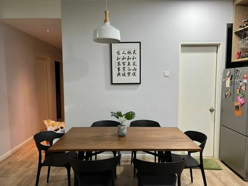 Dining features: wood dining table, 6 black dining chairs, white pendant light, framed artwork on wall, green plant in pot, light wood flooring, white painted walls, doorway leading to kitchen, refrigerator visible in background, decorative magnets on refrigerator; style: modern.