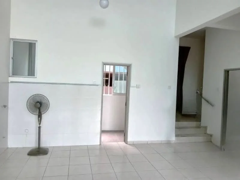 Room features: white painted walls, tile flooring, ceiling light fixture, window with white frame, doorway leading to another room, staircase visible in background, standing fan, open space layout; style: modern.
