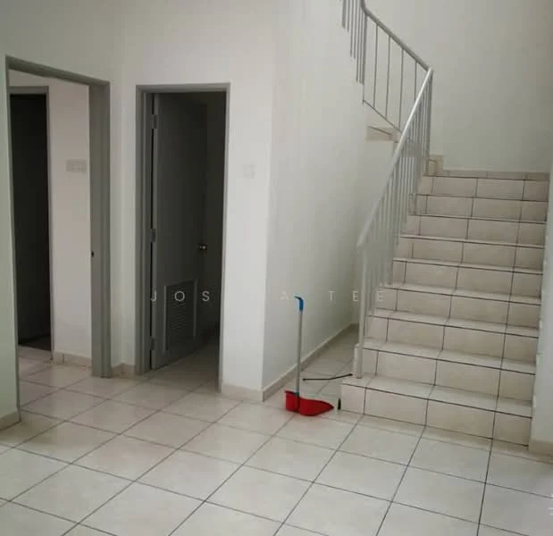 Room features: white painted walls, tile flooring, staircase with metal railing, doorway to adjacent rooms, light switch on wall, cleaning broom, neutral color scheme; style: modern.