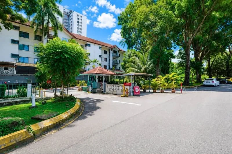 Exterior type: low-rise apartment block; features: guard house at entrance, manicured lawn, mature trees, paved driveway, surrounded by greenery, parking area visible, two-storey building, terracotta roof, balconies on upper floors, landscape garden; style: modern.