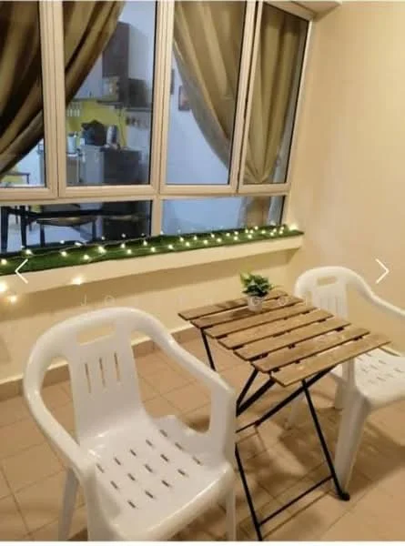 Room features: two white plastic chairs, wooden folding table, tile flooring, large window with glass panes, sheer curtains, decorative string lights, neutral wall color, greenery on table; style: minimalist.
