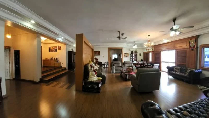Living features: wooden flooring, tray ceiling, 2 ceiling fans, 3-seater leather sofa, 2-seater fabric sofa, coffee table, wall-mounted artwork, large windows with wooden shutters, decorative wall paneling, chandelier, area rug; style: traditional. Dining features: 6-seater dining table, wooden dining chairs, decorative wall paneling, large windows with wooden shutters; style: traditional.
