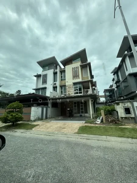 Exterior type: detached bungalow; features: three-storey building, stone cladding on facade, white painted facade, flat roof, large windows, balconies on upper floors, manicured lawn, paved driveway, surrounded by greenery, modern architectural design; style: modern.