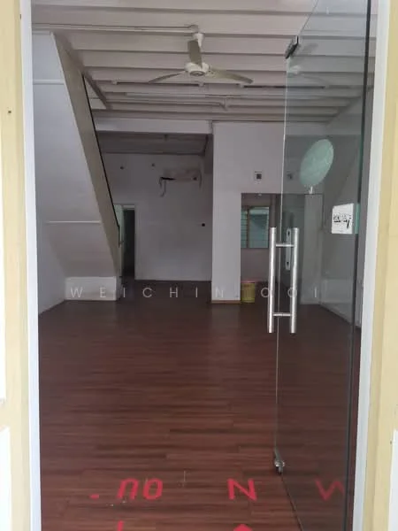 Room features: laminate flooring, white painted walls, exposed beams on ceiling, ceiling fan, glass door entrance, staircase visible, large windows, open layout; style: modern.