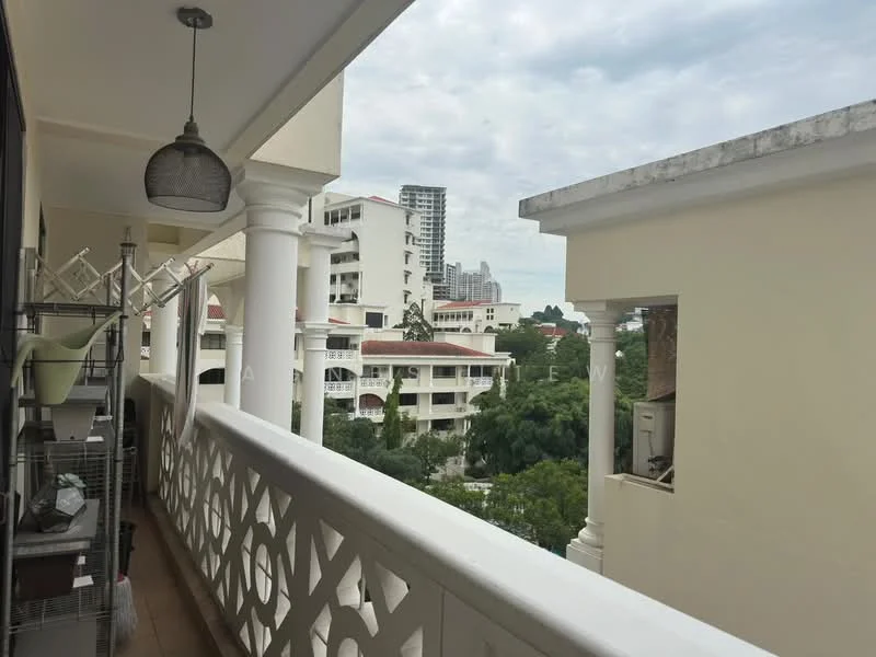 Balcony features: white railing, decorative balustrade, tile flooring, outdoor light fixture, clothes drying rack, view of surrounding buildings, view of greenery, partially covered area; view: city.