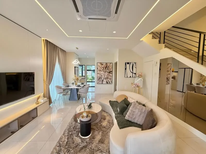Living features: L-shape sectional sofa in white, coffee table with black base, area rug with geometric pattern, wall-mounted TV, recessed LED downlights, ceiling-mounted air conditioning unit, floor-to-ceiling windows, curtains in neutral color, decorative wall art, decorative vase with flowers, dining area with round table and chairs visible in background, staircase with black railing; style: modern; view: garden.