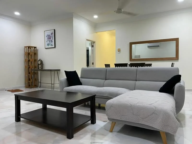 Living features: 3-seater fabric sofa in grey, L-shape sectional sofa, black throw pillows, coffee table with black surface, marble flooring, recessed downlights, wall-mounted mirror, decorative wall art, wooden side table, dining area visible in background, ceiling fan; style: modern.