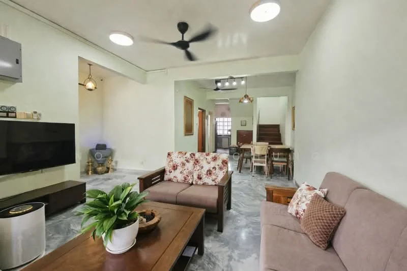 Living features: 3-seater fabric sofa in beige, 2-seater fabric sofa with floral pattern, wood coffee table, wall-mounted TV, ceiling fan with 3 blades, recessed downlights, decorative plant in ceramic pot, grey polished concrete flooring, white painted walls, wooden staircase visible in background, dining area visible in background; style: modern.