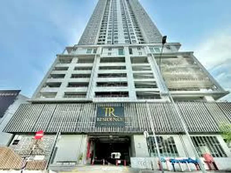 Exterior type: high-rise condominium; features: glass curtain wall, exposed concrete facade, recessed balconies, feature lighting at night, double-volume main lobby, guard house at entrance; style: modern.