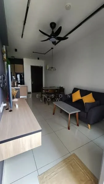 Living features: 3-seater fabric sofa in dark grey, 2 yellow accent cushions, wooden coffee table, TV console, wall-mounted TV, recessed downlights, 5-blade ceiling fan, white painted walls, glossy tile flooring, open layout to kitchen, decorative wall art, window with sheer curtains; style: modern.