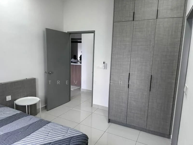 Bedroom features: grey striped bedding, white walls, glossy white floor tiles, built-in wardrobe with grey finish, white round side table, door leading to hallway, door leading to kitchen area, window with natural light; style: modern.