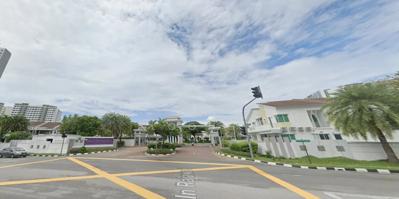 Exterior type: gated community; features: manicured lawn, mature palm trees, paved driveway, guard house at entrance, traffic light, surrounded by greenery, two-storey residential buildings, decorative entrance gate; style: modern.