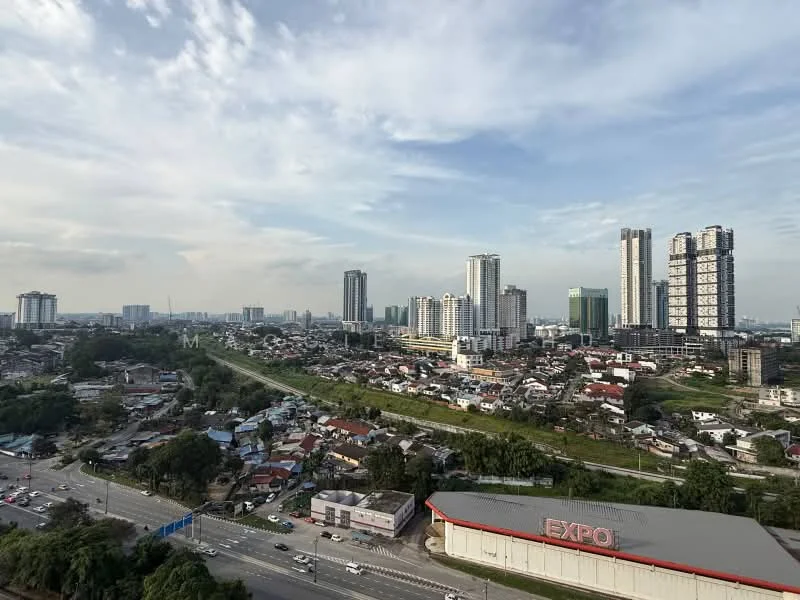 Exterior type: high-rise condominium; features: city skyline view, surrounded by urban development, near main road, multiple high-rise buildings, greenery in the foreground, commercial building with large signage, mixed residential and commercial area; style: modern.