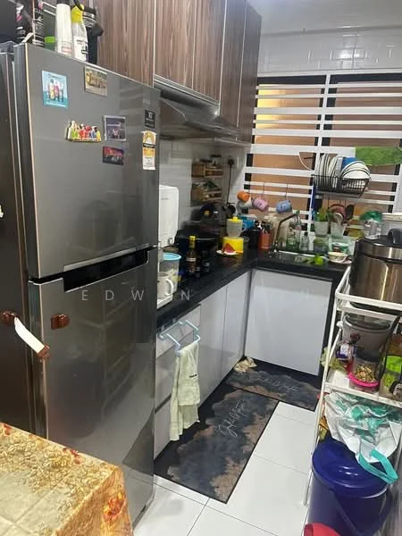 Kitchen features: stainless-steel fridge, black granite countertop, white cabinetry, ceramic tile flooring, wall-mounted shelves, kitchen sink, various kitchen appliances, decorative kitchen mat, window with blinds, multiple containers and utensils; style: modern.