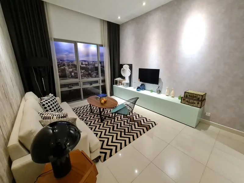 Living features: white fabric sofa, black and white patterned throw pillows, chevron patterned area rug, wooden coffee table, green console table, wall-mounted TV, floor lamp, decorative vases, fan, large windows with city view, grey accent wall, recessed lighting; style: modern; view: city.