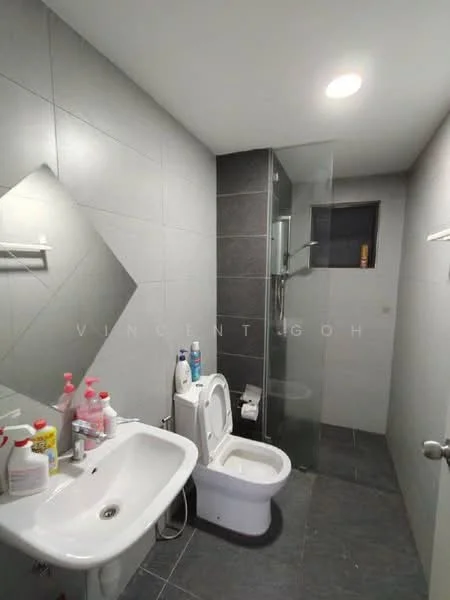 Bathroom features: grey tiled walls, dark grey tiled flooring, single-sink vanity with white cabinet, chrome basin mixer faucet, one-piece toilet, walk-in shower with glass enclosure, rain shower head, handheld shower, mirror above sink, recessed ceiling lights; style: modern.