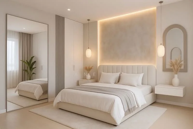 Bedroom features: king-size bed with upholstered headboard, white bedding with decorative pillows, two bedside tables with pendant lights, full-length mirror, built-in wardrobe with sliding doors, accent wall with soft lighting, neutral wall color, wooden flooring, decorative plant in corner, recessed ceiling lights; style: modern.