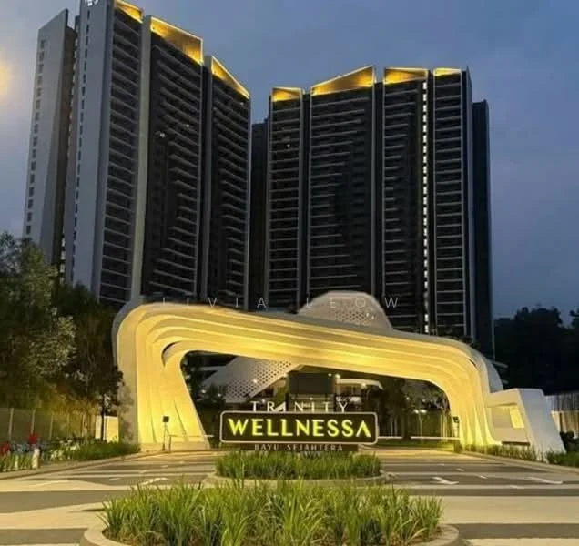 Exterior type: high-rise condominium; features: modern architectural design, illuminated facade, curved entrance structure, landscaped garden with greenery, multiple storeys, glass curtain wall, prominent signage, night lighting, surrounding trees; style: modern.
