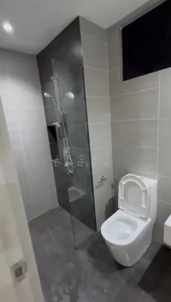 Bathroom features: walk-in shower with glass enclosure, chrome handheld shower, grey ceramic tile flooring, grey wall tiles, white toilet, single-sink vanity with white cabinet, mirror above vanity, window for natural light; style: modern.
