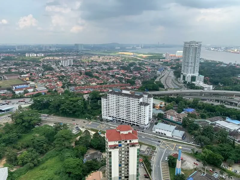 Exterior type: high-rise condominium; features: city skyline view, surrounded by greenery, multiple buildings visible, highway in foreground, urban landscape, mixed residential and commercial areas; style: modern.