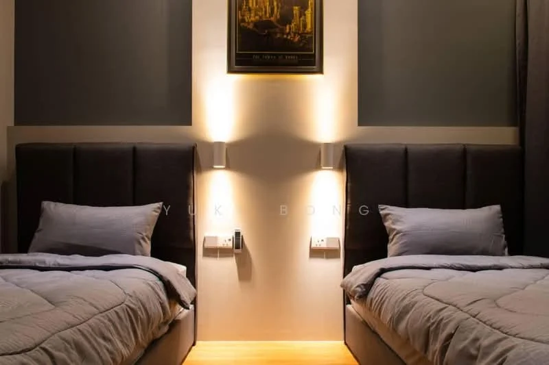 Bedroom features: two single beds with upholstered headboards, grey bedding, wooden flooring, dark accent wall, light fixtures mounted on the wall, framed artwork above the beds, nightstand with power outlets, decorative wall lighting; style: modern.