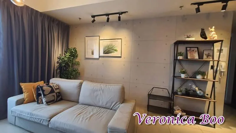 Living features: light grey fabric sofa, decorative throw pillows, concrete accent wall, framed artwork on wall, indoor plant, black shelving unit, decorative items on shelves, track lighting, floor-to-ceiling curtains, neutral tile flooring; style: modern.