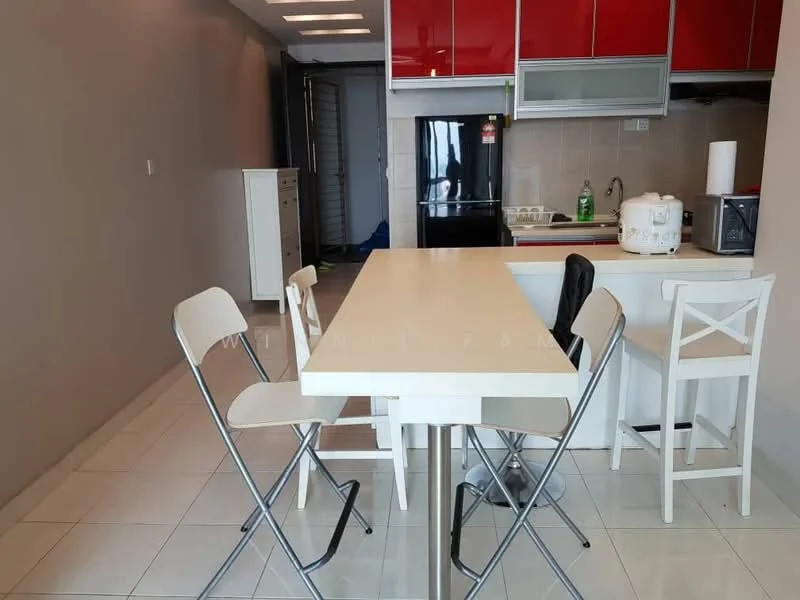 Kitchen features: white dining table, 4 white folding chairs, red upper cabinets, grey lower cabinets, black refrigerator, white rice cooker, white microwave, ceramic tile flooring, light grey painted walls, stainless-steel sink, chrome faucet, open layout, countertop with bar seating; style: modern.