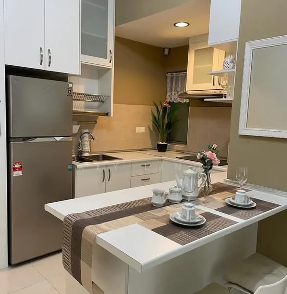 Kitchen features: white cabinetry, stainless-steel fridge, single-bowl stainless-steel sink, chrome pull-down faucet, white countertop, ceramic tile backsplash, built-in oven, 4-burner gas hob, wall-mounted cabinets, kitchen island with seating, decorative plant, table setting with cups and plates, recessed downlights, window with sheer curtains; style: modern.