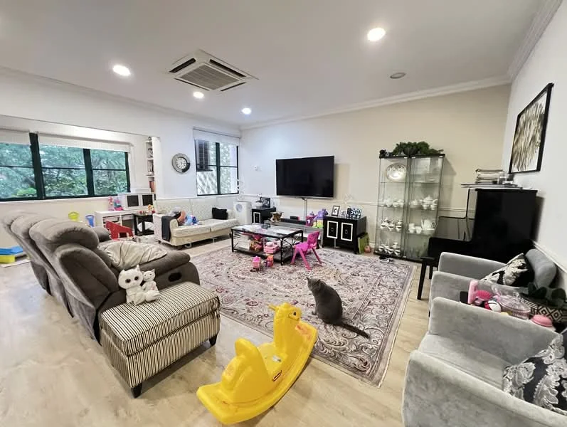 Living features: 3-seater fabric sofa in grey, 2-seater striped sofa, coffee table, TV console, wall-mounted TV, area rug with intricate pattern, piano, glass display cabinet, decorative wall art, large windows with black frames, ceiling-mounted air conditioning unit, light fixtures with recessed lighting, children's toys scattered, yellow plastic ride-on toy, cat; style: modern; view: garden.