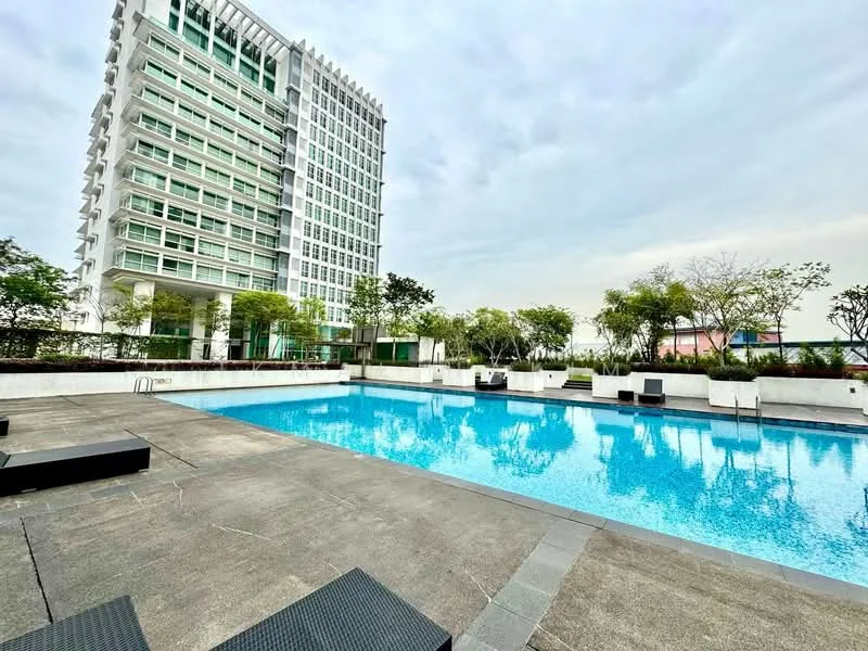 Exterior type: high-rise condominium; features: infinity pool, pool deck with loungers, surrounded by greenery, concrete paving, landscaped garden, glass curtain wall facade, multiple storeys, urban skyline view in background; style: modern.