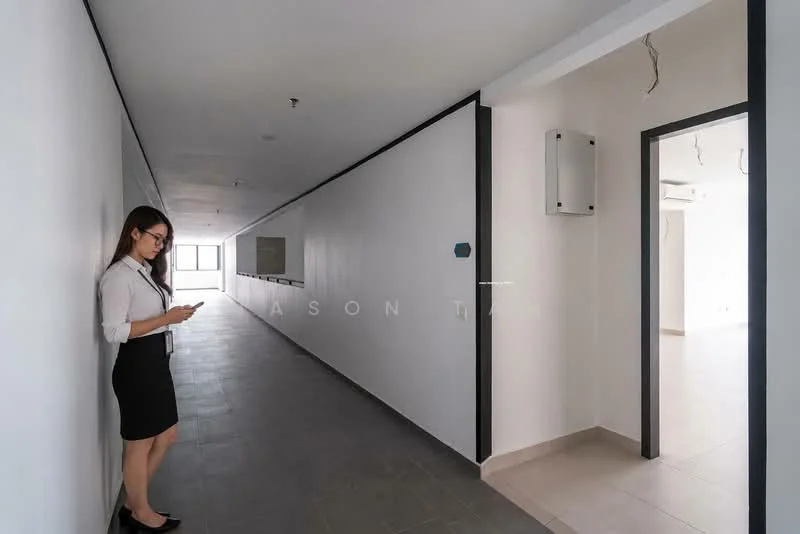Hallway features: white painted walls, grey tiled flooring, recessed ceiling lights, black trim on walls, open layout, doorway leading to another room, wall-mounted electrical panel, large windows at the end of the hallway; style: modern.